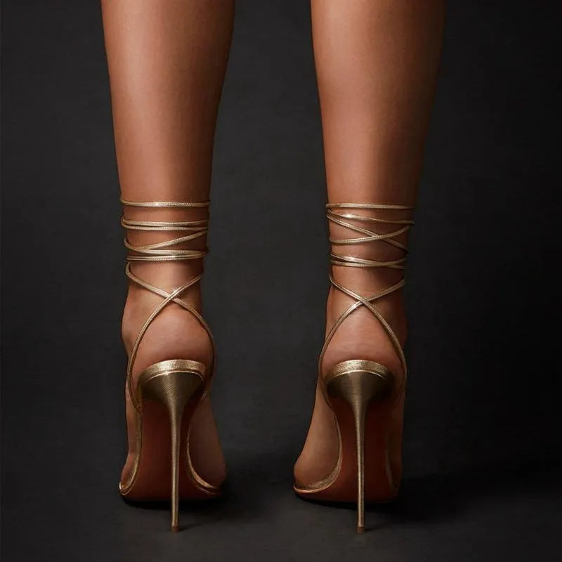 Gold women's ankle strap stiletto sandals with pointed toe and side air detail