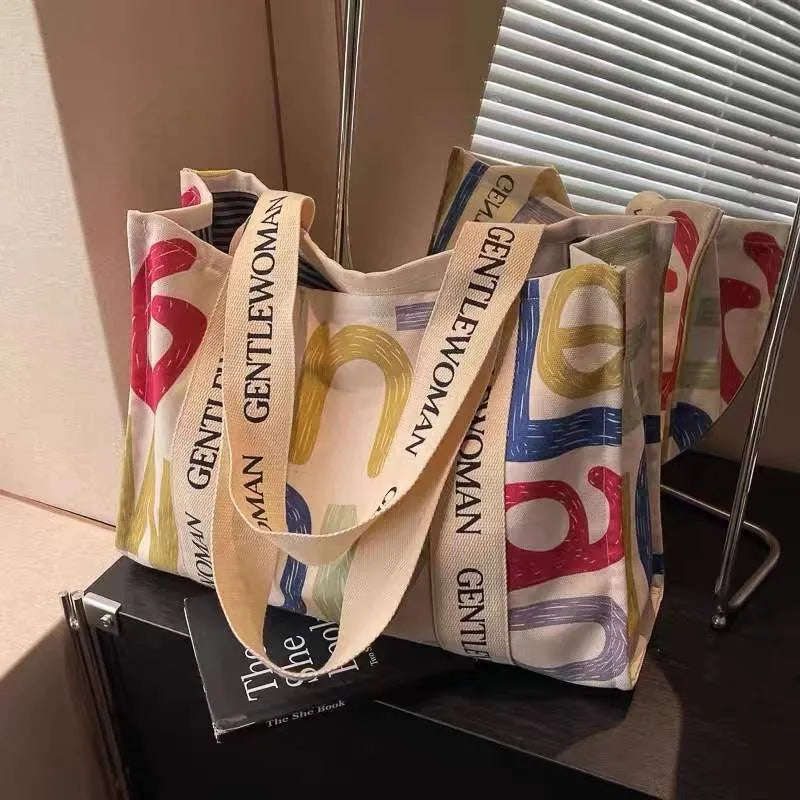A large canvas tote bag with a printed design, shown in a choice of styles.