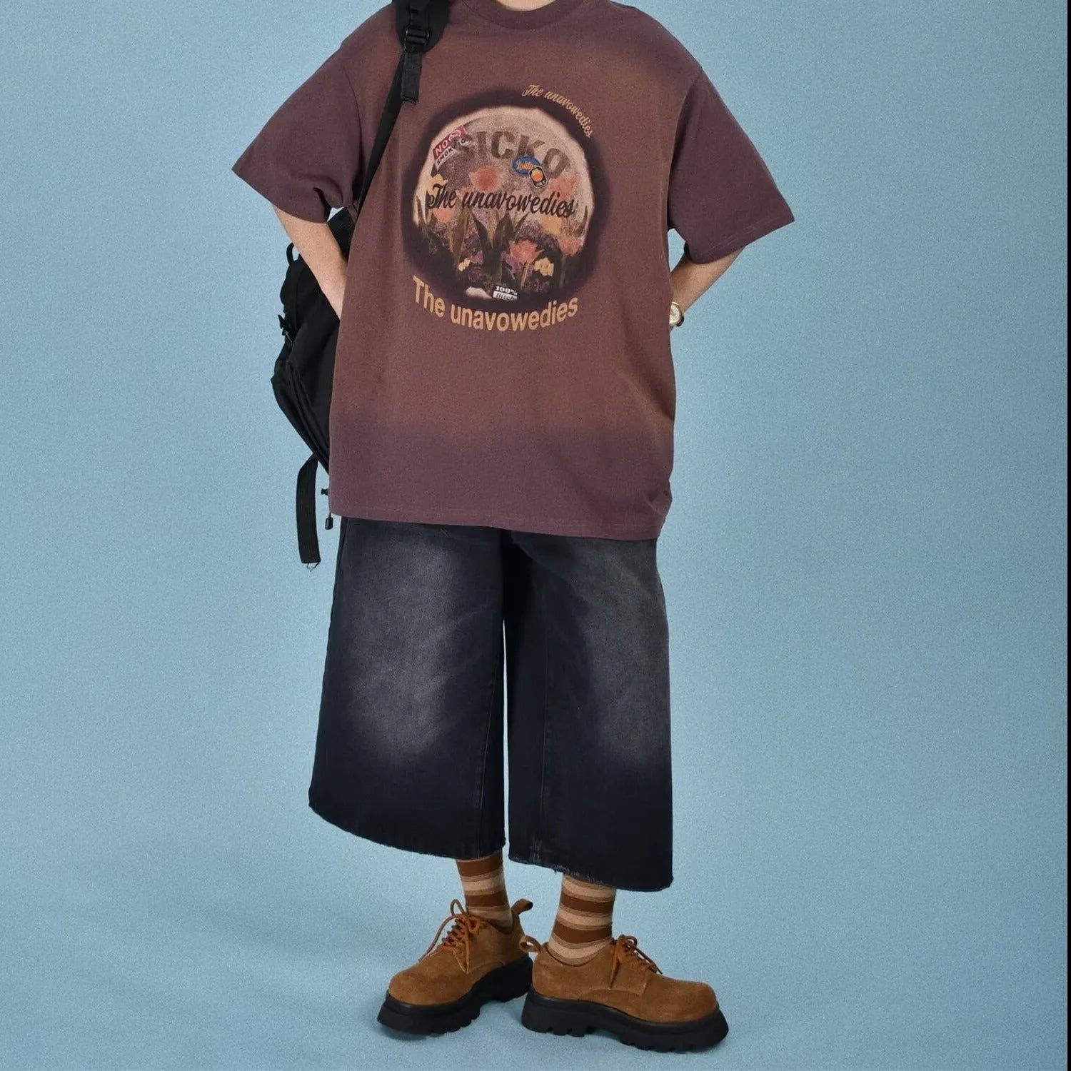 Men's straight-leg denim summer shorts in blue colour showing fifth-pant length and loose fit