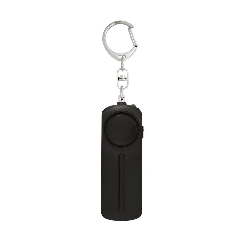 Compact pink personal safety alarm with keyring, shown at 86mm long.