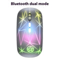 Wireless gaming mouse with RGB lighting and metal scroll wheel on black surface