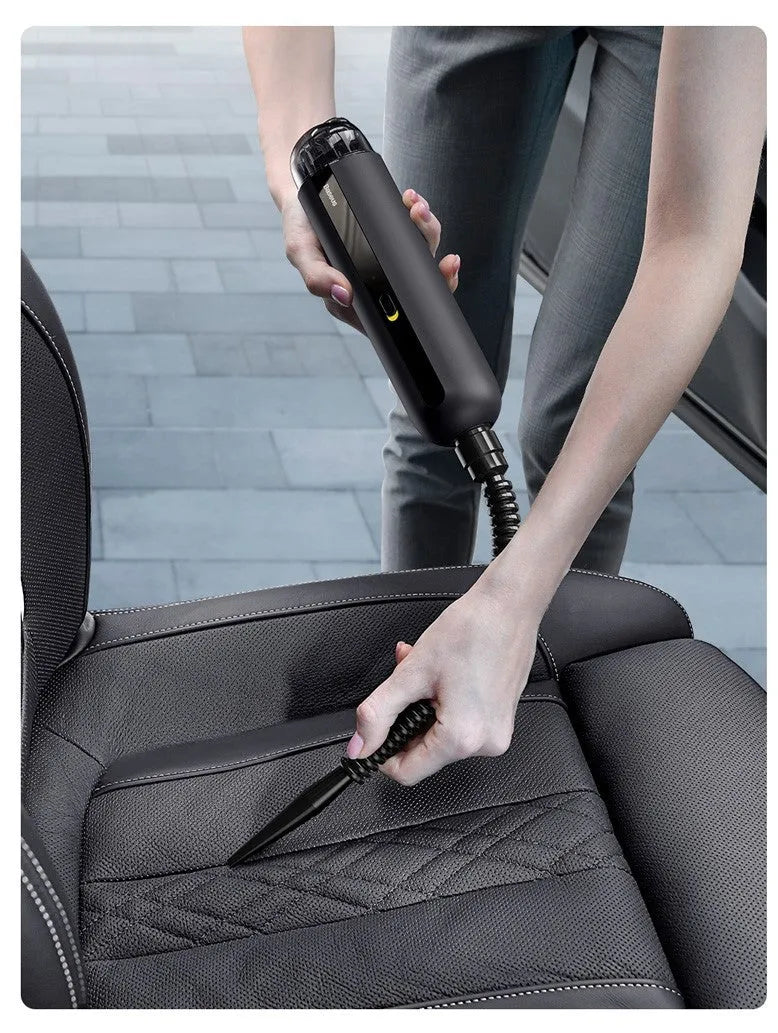 Starry Sky Black wireless handheld car vacuum cleaner with blowing hose on a car seat