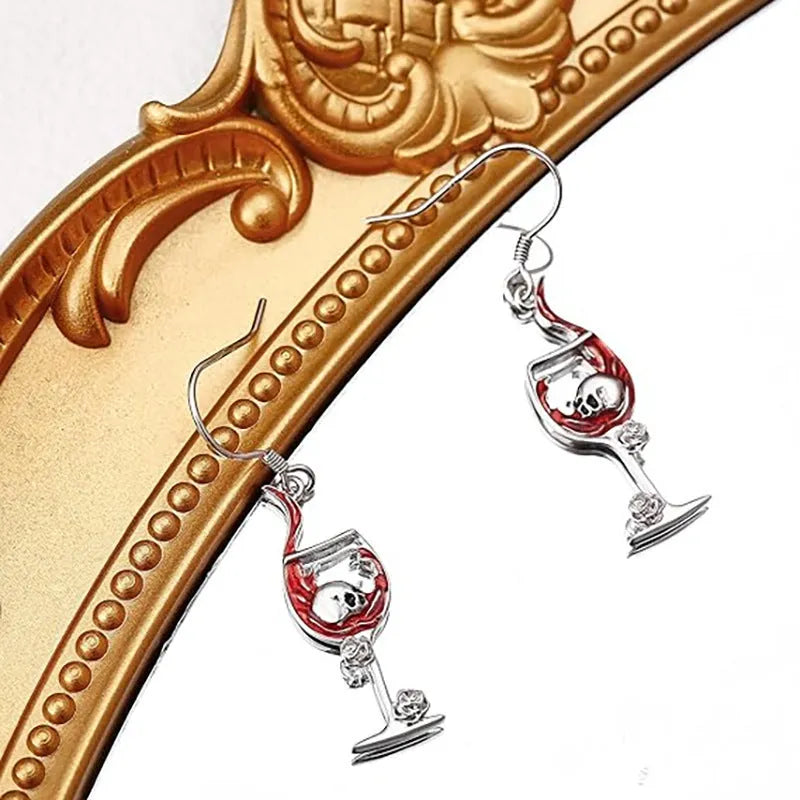 Geometric zinc alloy dangle earrings featuring a detailed Halloween skull charm with an electroplated metallic finish.