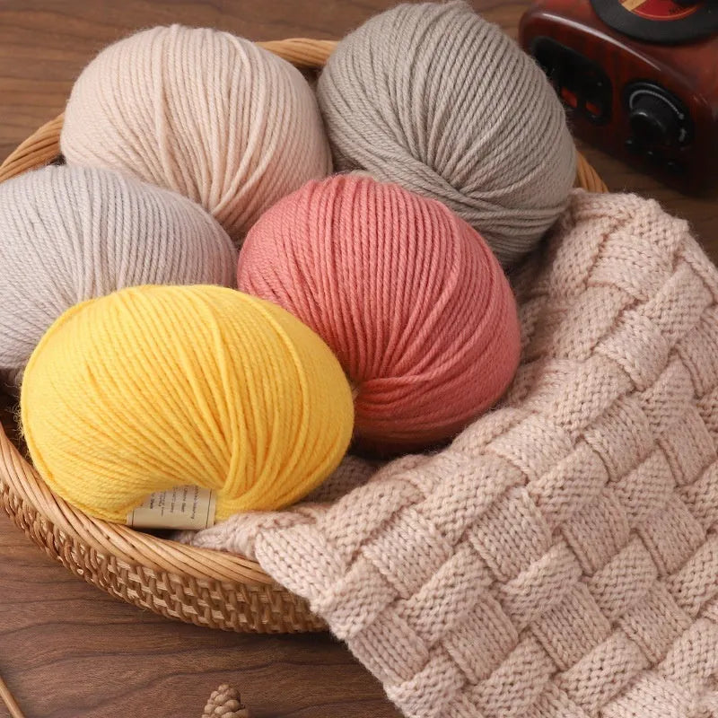 Roll of domestic wool knitting yarn for 10 needles in various colours including green, red, and blue