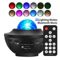 Black parallel-style starry sky projection lamp with water ripple laser effects on desktop