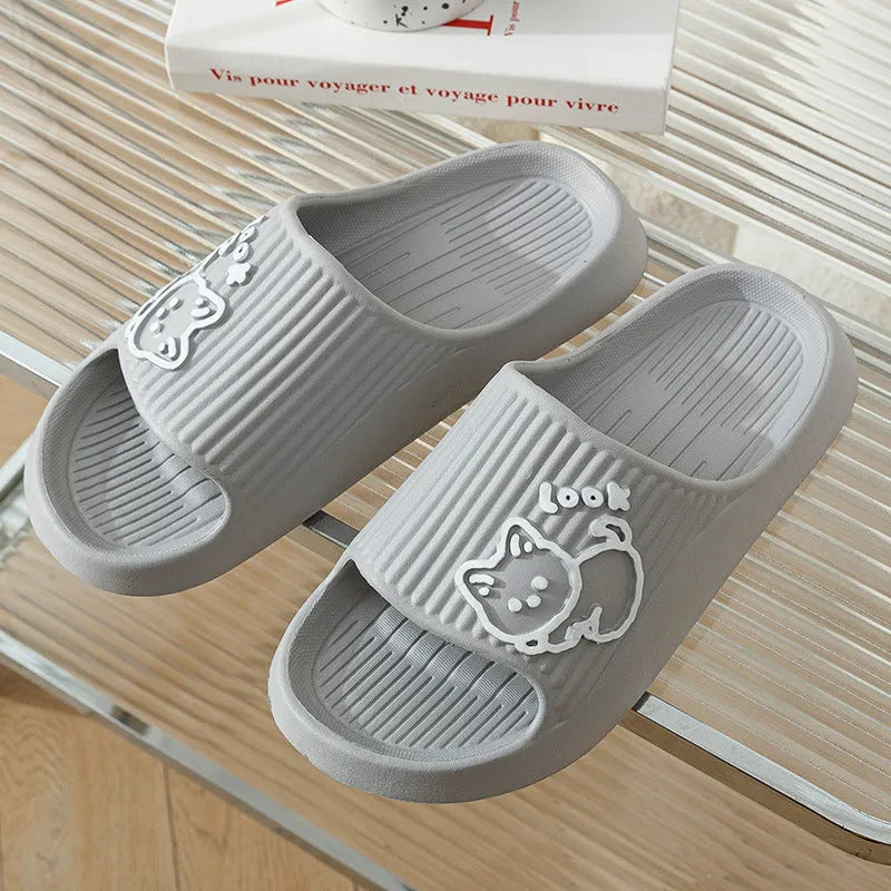 Women's green cat slippers with thick EVA platform sole on a wooden floor