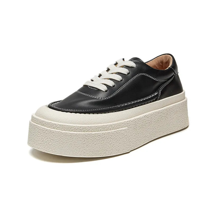 Women's black platform sports shoes with embossed cowhide leather upper and rubber sole
