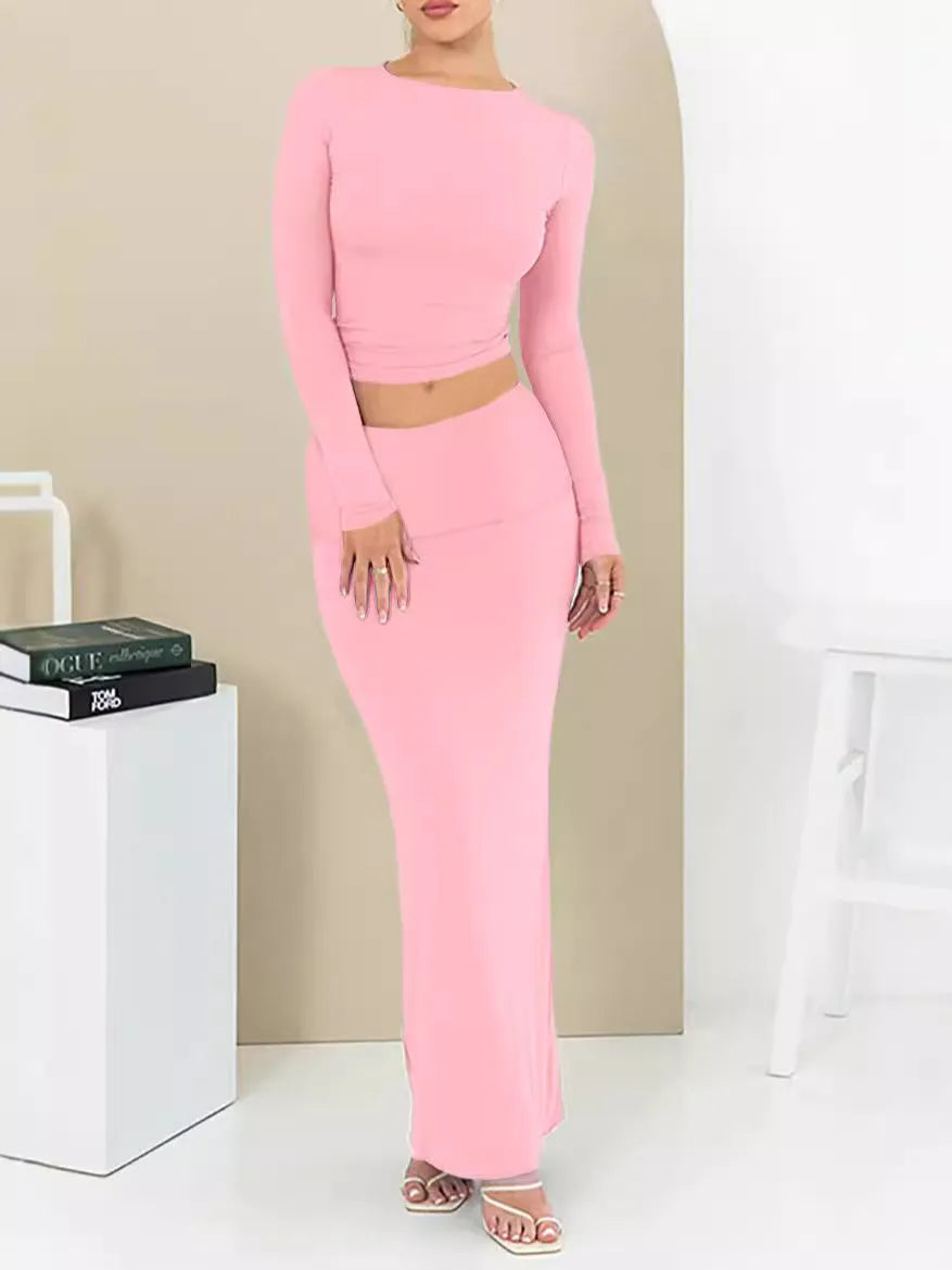 Women's black two-piece autumn suit featuring a crop top and long skirt in a slim fit.