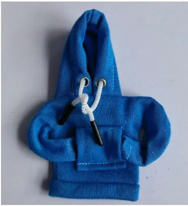 Cloth gear shift knob hoodie cover in assorted colours, shown next to a car gear stick.