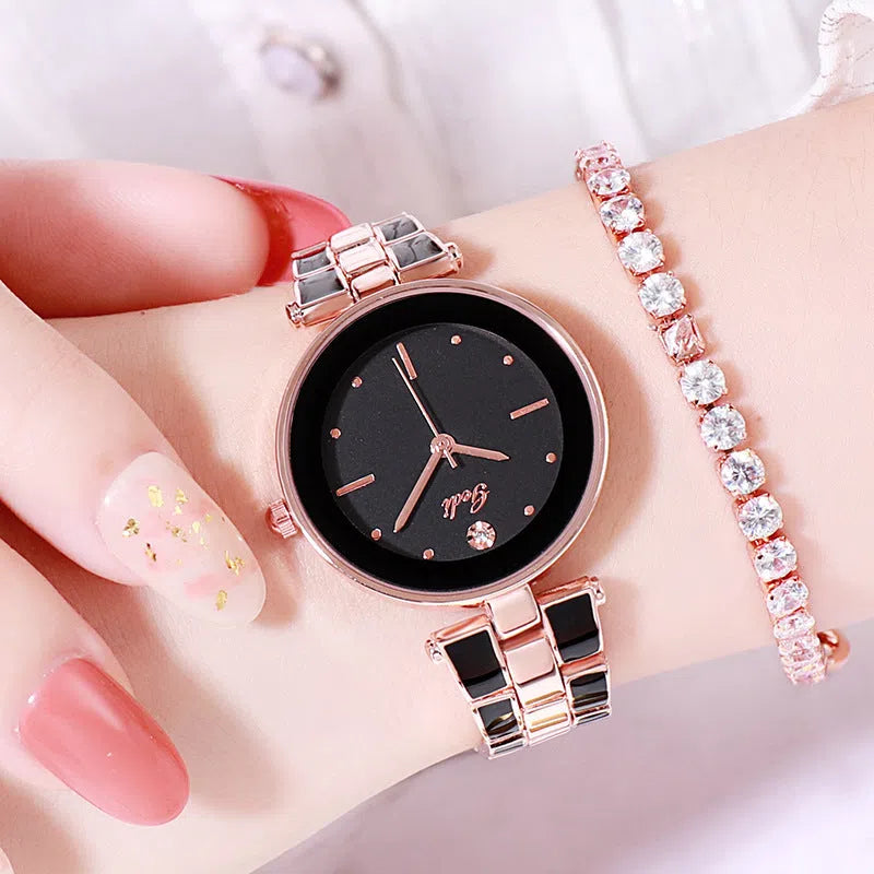 Ladies quartz watch with white round dial, steel strap, and rose gold sheen on a plain background