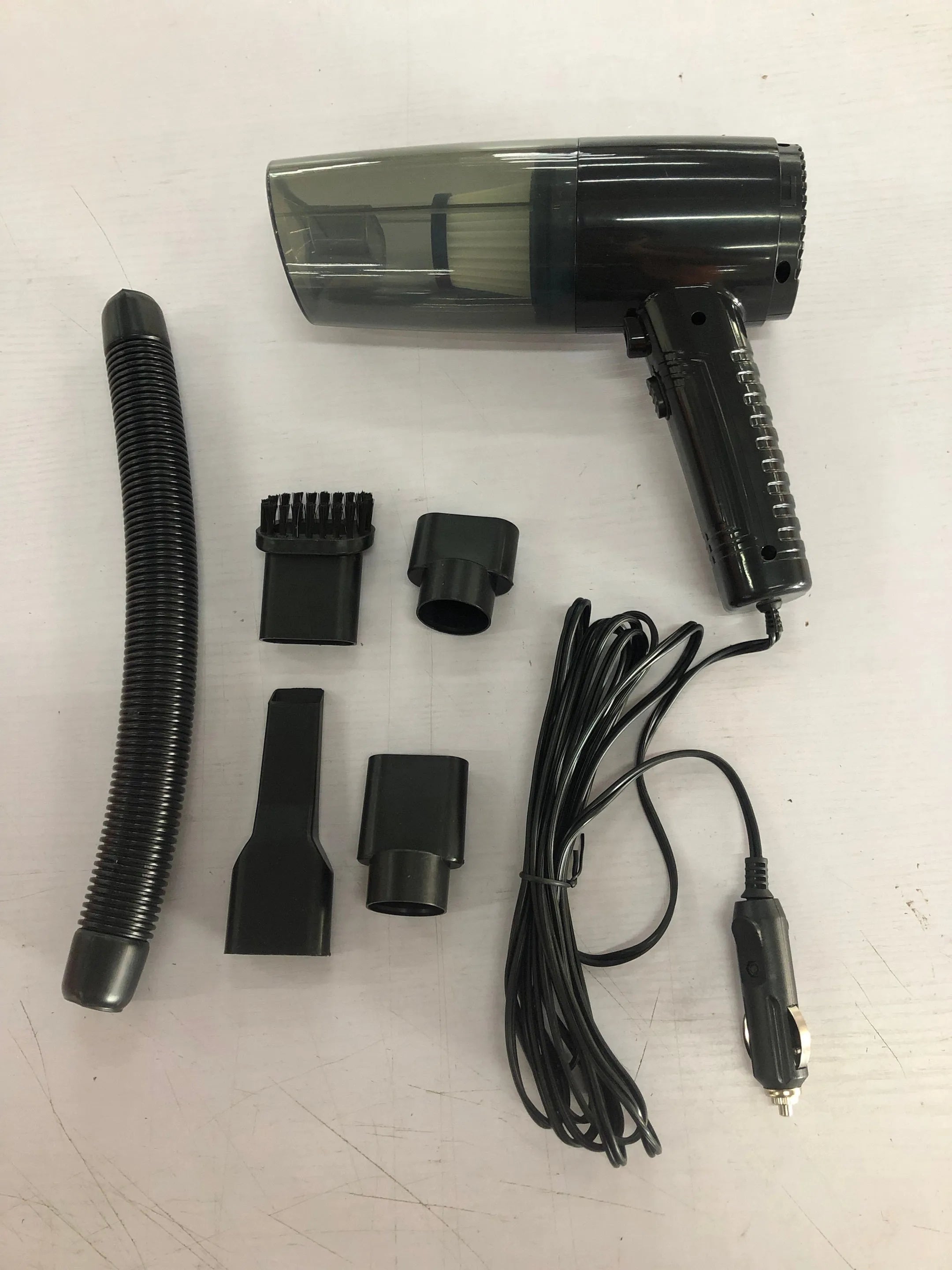 Black portable car vacuum cleaner with ABS shell and multiple suction accessories