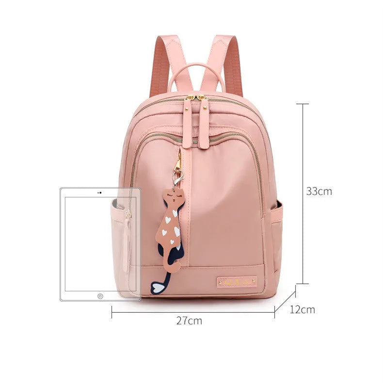Women's black nylon backpack with square vertical shape showing internal compartments and shoulder straps