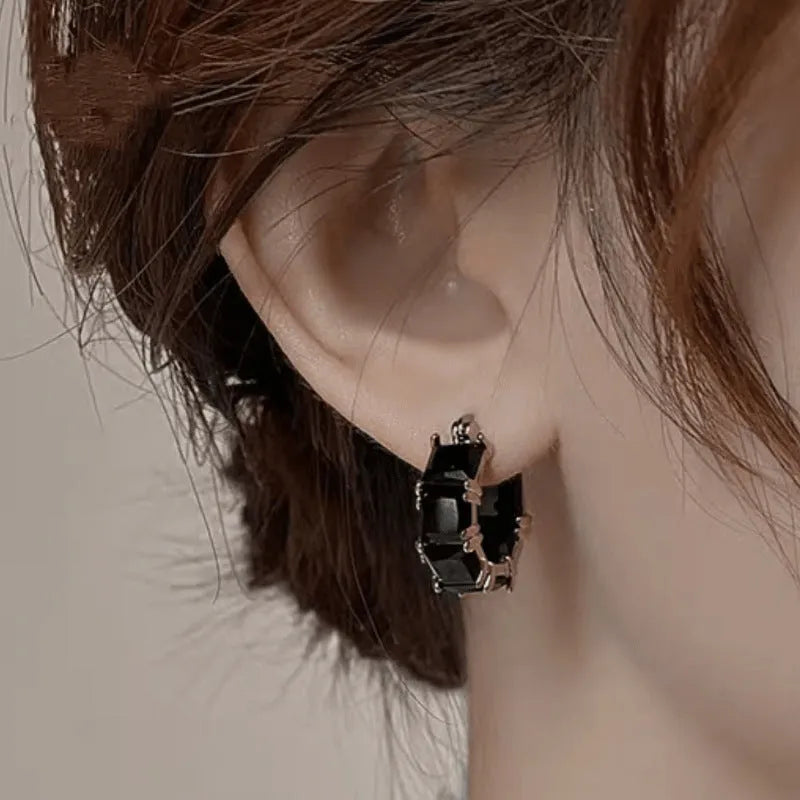 Gold electroplated copper earrings with geometric U-shape design and zircon crystals