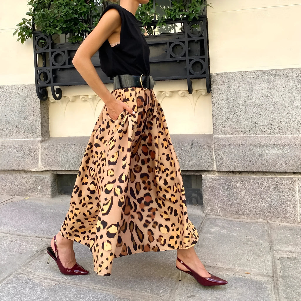 Brown leopard print women's A-line long skirt with a large hemline, shown on a model.
