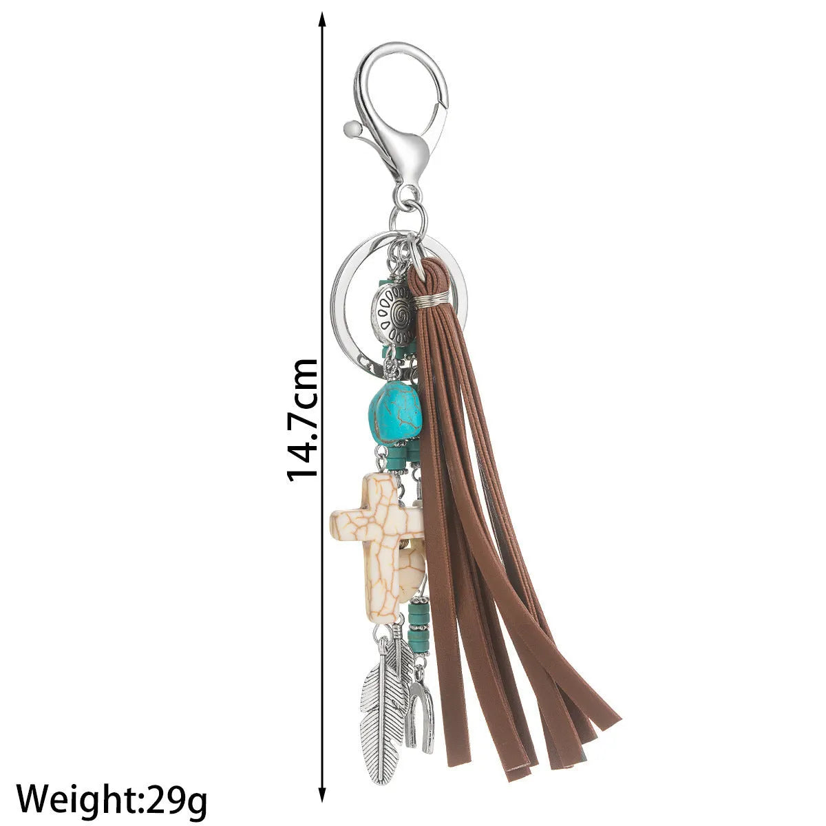 Alloy cross pendant keychain with leather rope and tassel in colour XY-3669 on a wooden surface