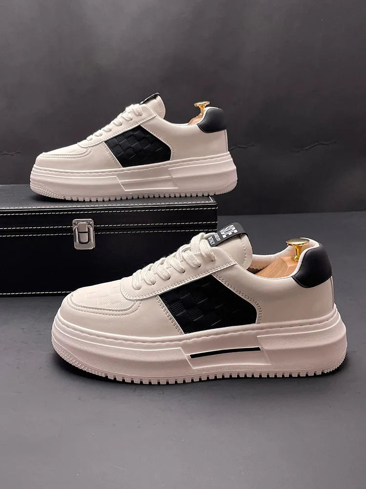 White unisex leisure shoes with cloth uppers and rubber foam soles in green or black accent colours