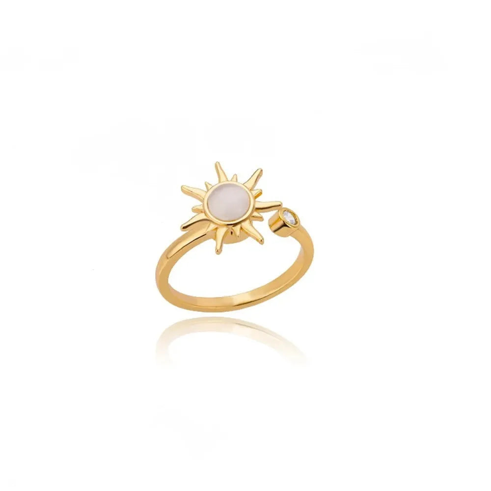 Simple open mouth adjustable copper ring in gold colour on a grey background