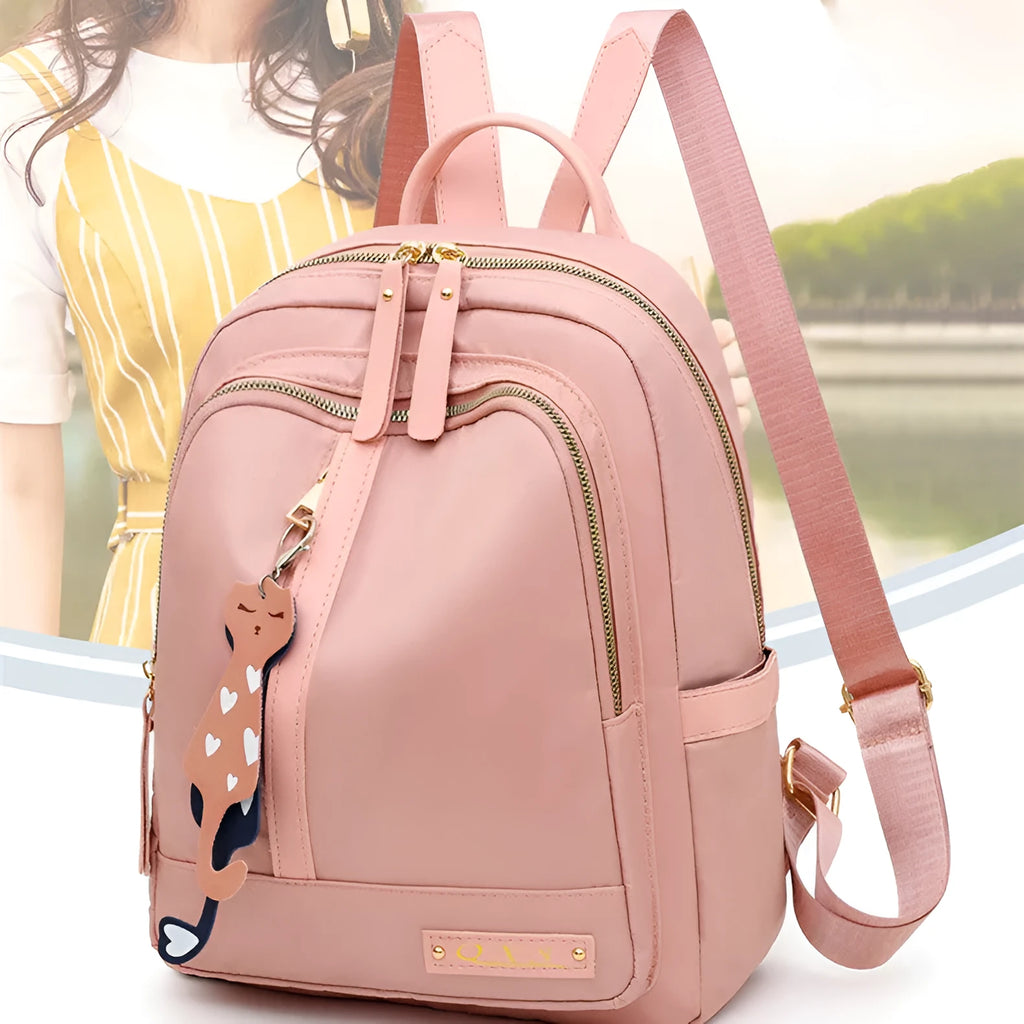 Women's black nylon backpack with square vertical shape showing internal compartments and shoulder straps