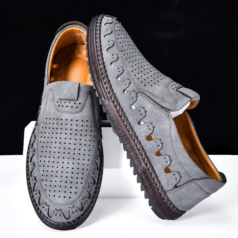 Men's brown casual slip-on leather shoes with round toe and flat sole.