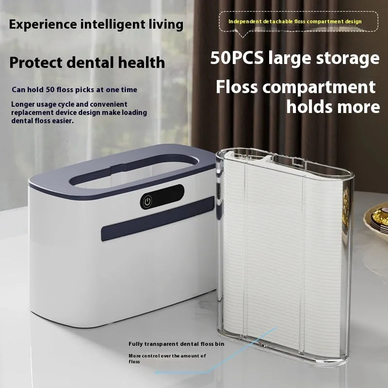 Dark grey automatic electric dental floss box with intelligent induction sensor on a bathroom countertop.