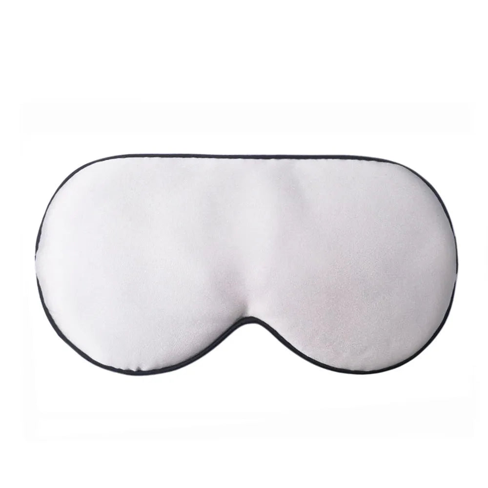 Double-sided mulberry silk eye mask in champagne colour with embroidered print.