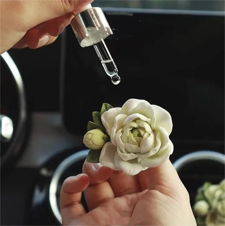 Solid gypsum car vent air freshener in jasmine fragrance, showing off-white or green colour.