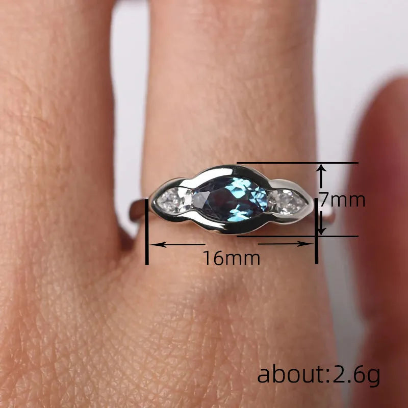 Geometric ellipse women's ring with inlaid zircon stone in white gold plating