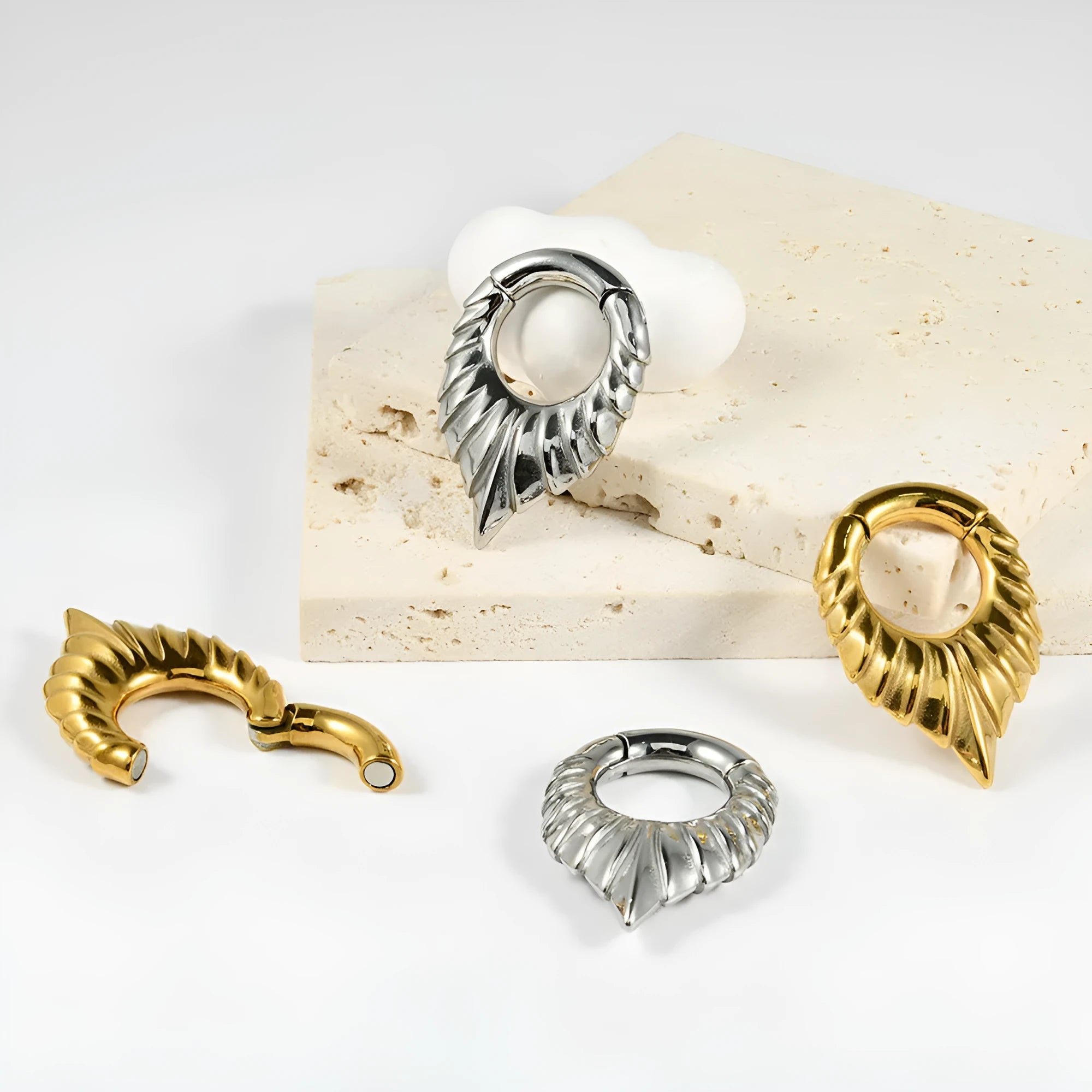 Stainless steel drop-shaped auricle ear extenders with round hanging egg and totem detailing
