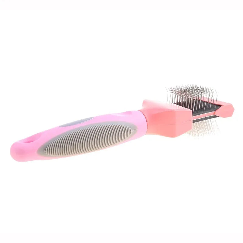 Blue double-sided pet brush with ergonomic handle shown next to pink version, displaying soft and firm stainless steel pin sides.