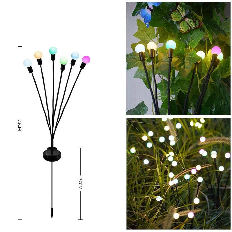 Solar-powered LED garden ground light with multiple heads and a stainless steel stake inserted into soil.