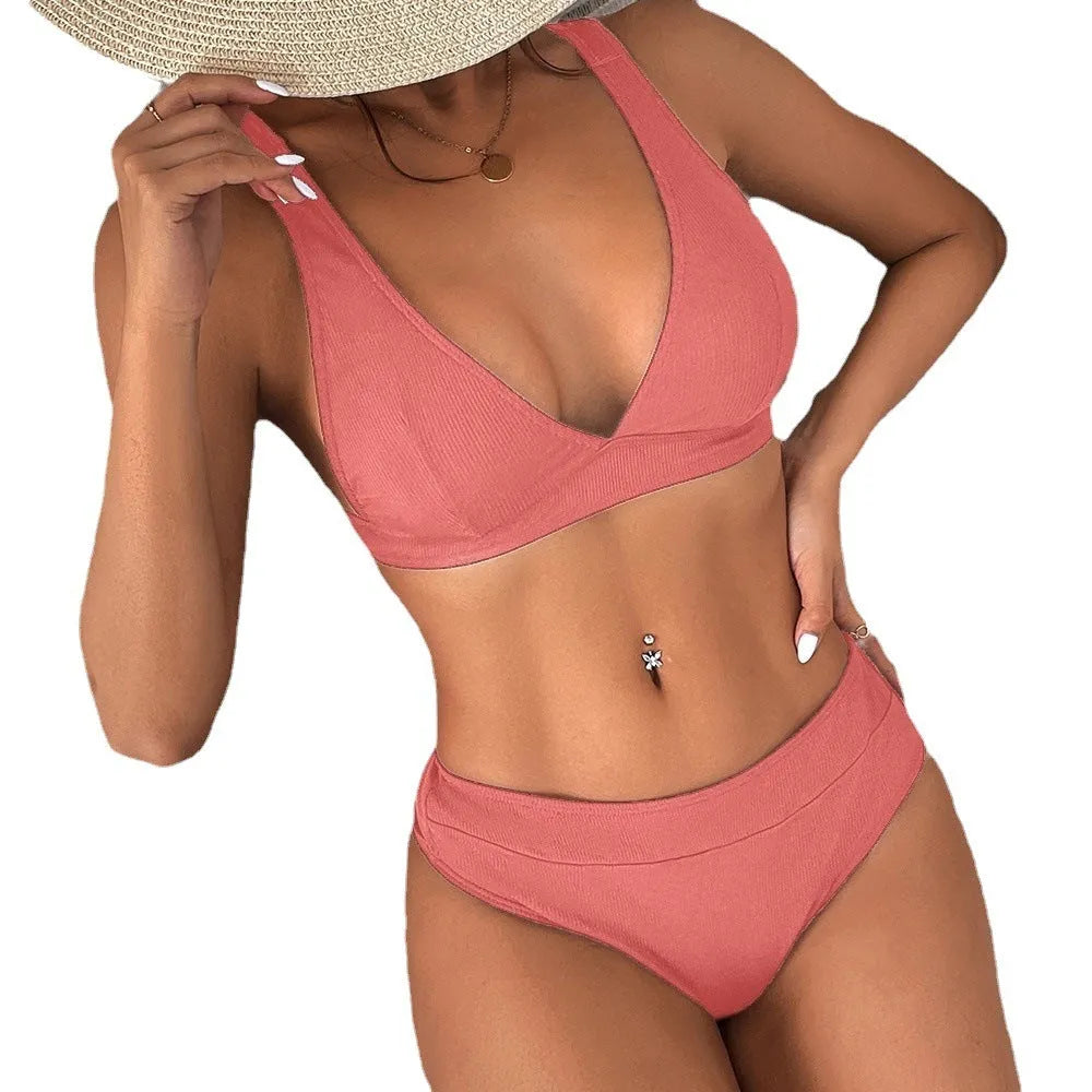 Women's black bikini set with rib lace-up detail on the top and high-leg split briefs.