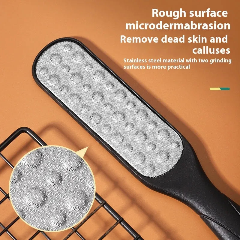 Double-sided stainless steel foot grinder with black and white grit attachments for callus removal