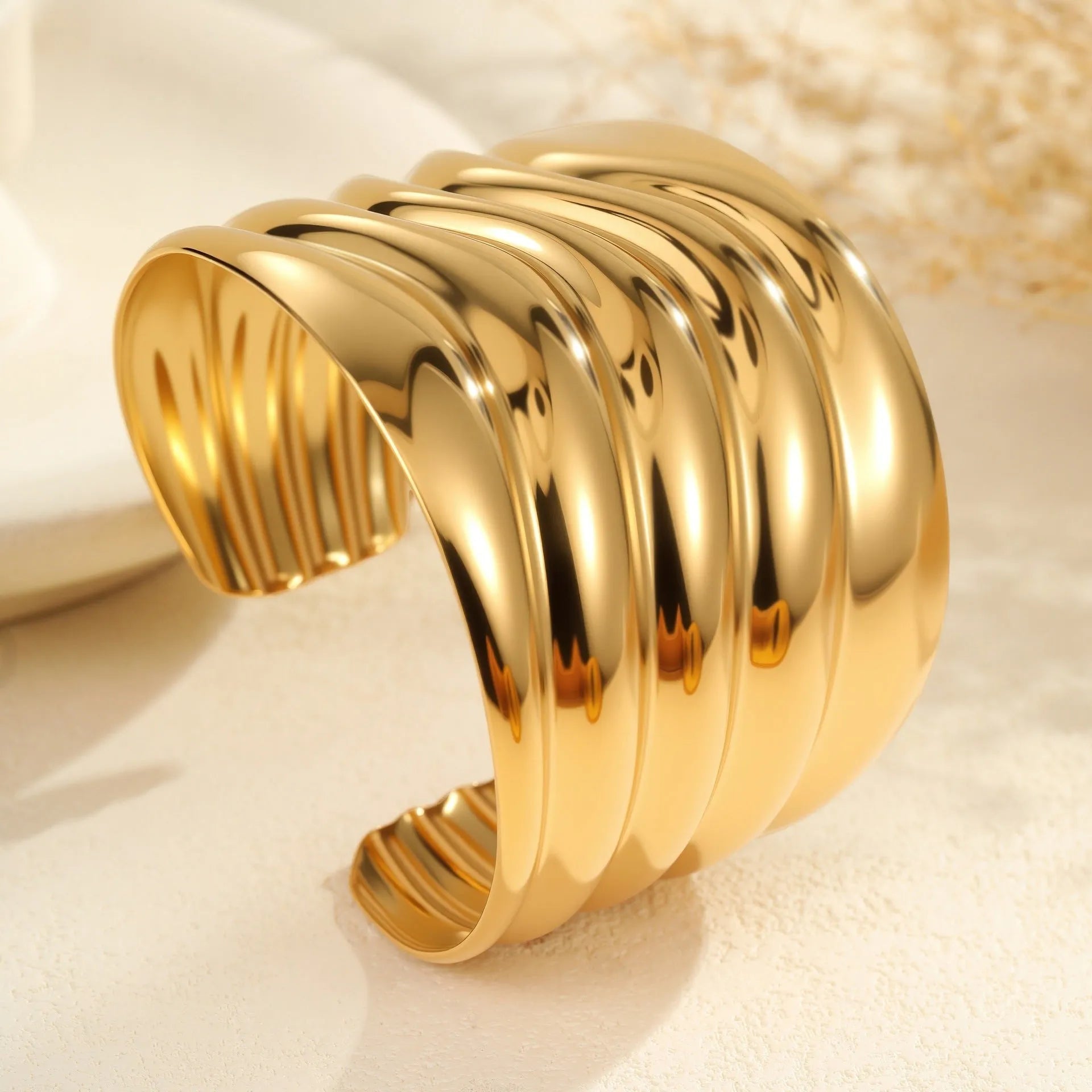 Women's gold plated stainless steel wide bracelet with wave geometric asymmetric design