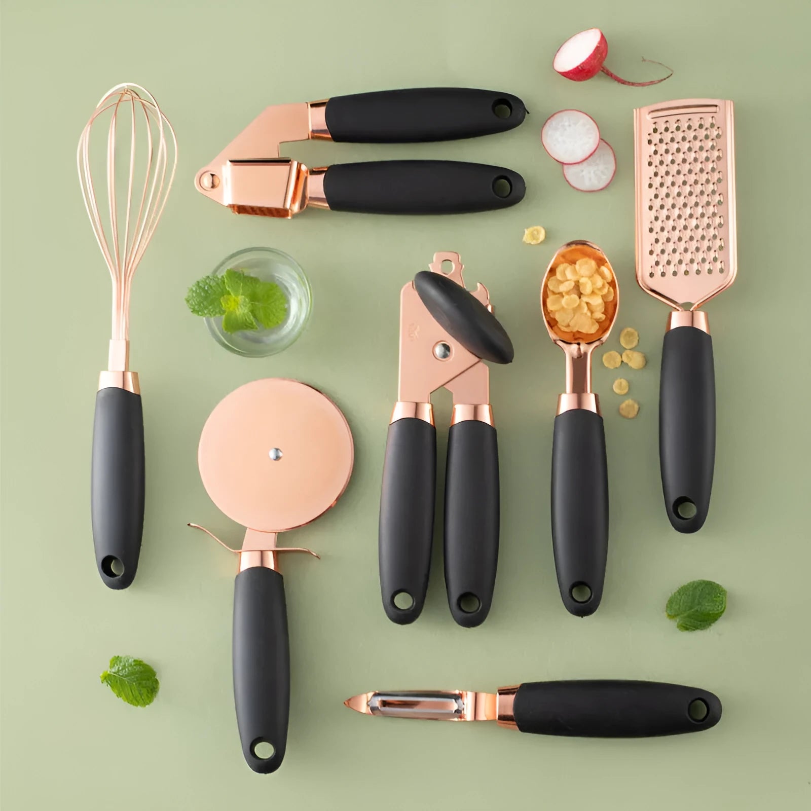 7-piece stainless steel kitchen tool set with copper plating peeler gadget in a cutlery rack on a countertop