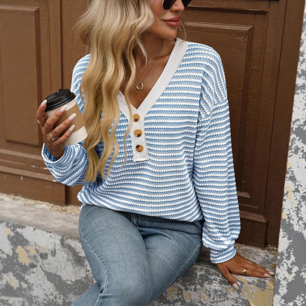 Women's loose fit V-neck pullover top with long sleeves and patchwork detail in a colour selection.