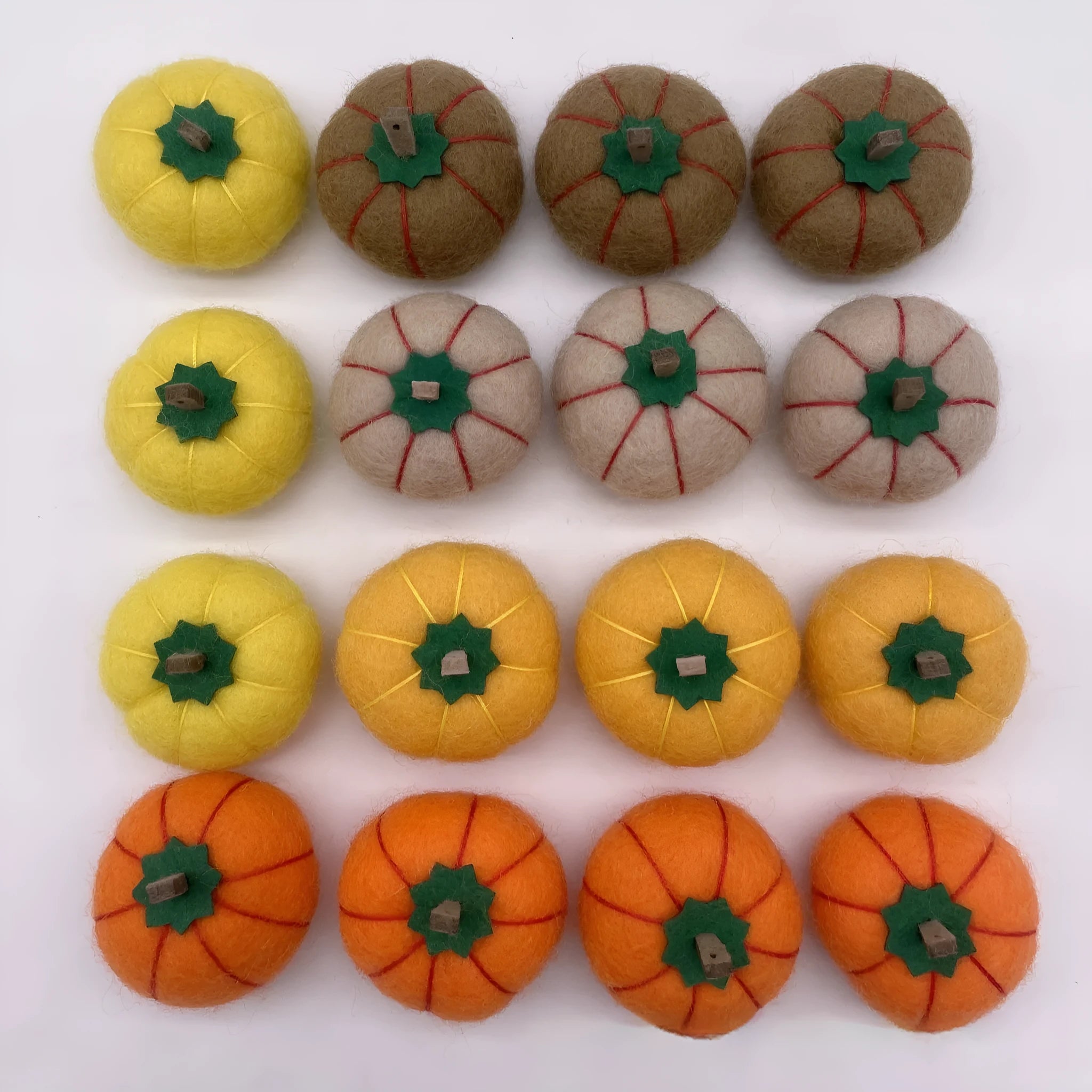 Wool felt pumpkin ornament decorations in autumn colours for seasonal displays