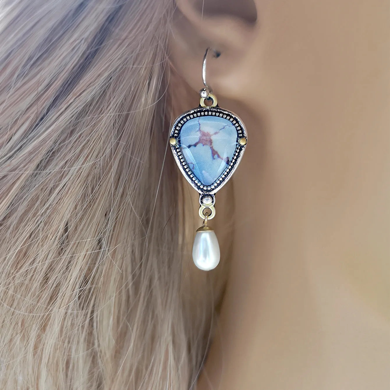 Retro blue Bohemian style drop earrings with geometric metal design, synthetic blue opal and white pearl elements
