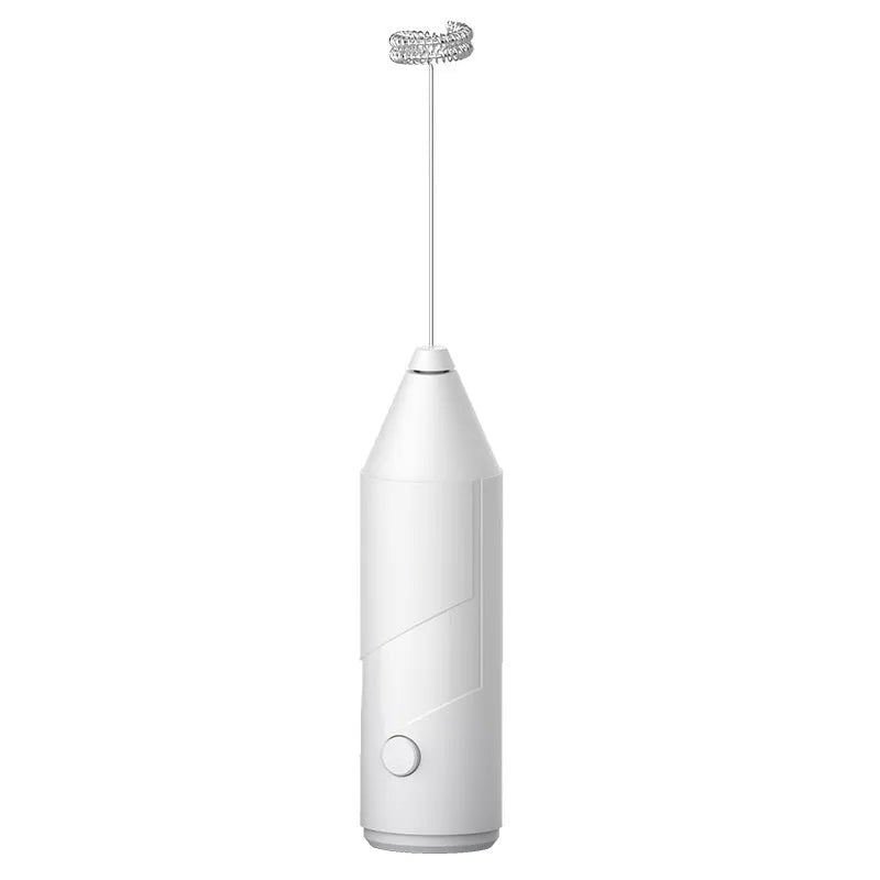 Compact black handheld milk frother with stainless steel whisk on a kitchen counter.