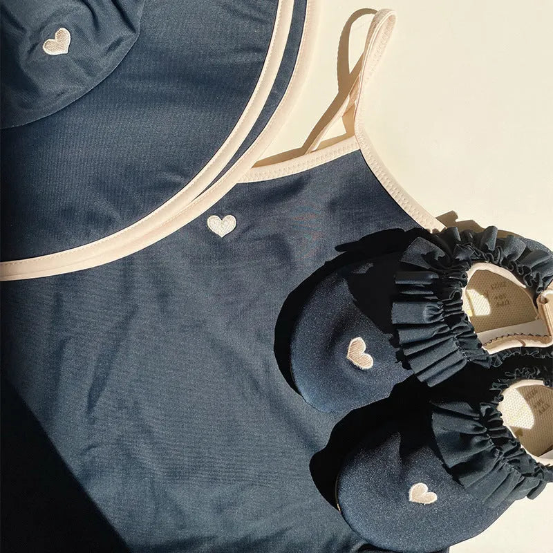 Dark blue baby girl swimsuit in polyester with Lycra lining for swimming activities