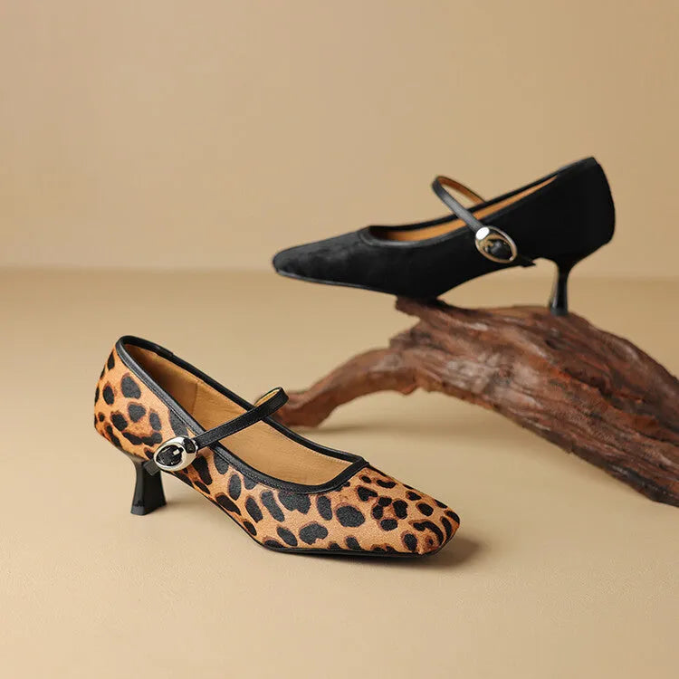 Women's black square toe stiletto ankle-strap shoes with horse hair upper and buckle fastening.
