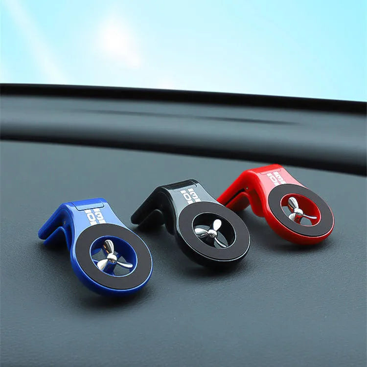 Magnetic car phone holder mounted on air vent with smartphone attached