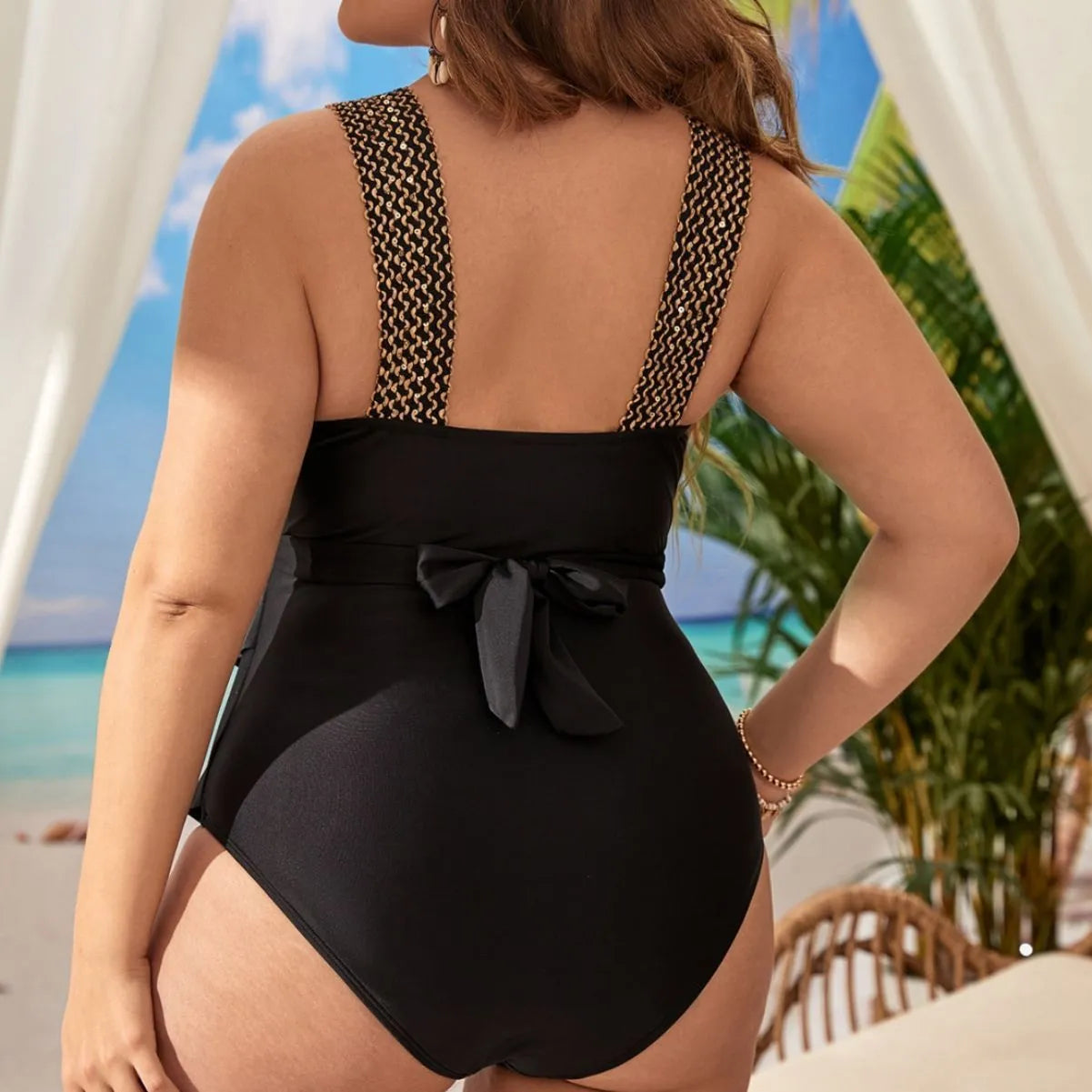 Women's black one-piece sleeveless swimsuit on a hanger