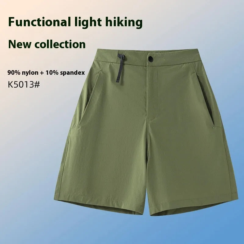 Men's solid colour quick-drying sports shorts with elastic waist on a neutral background.