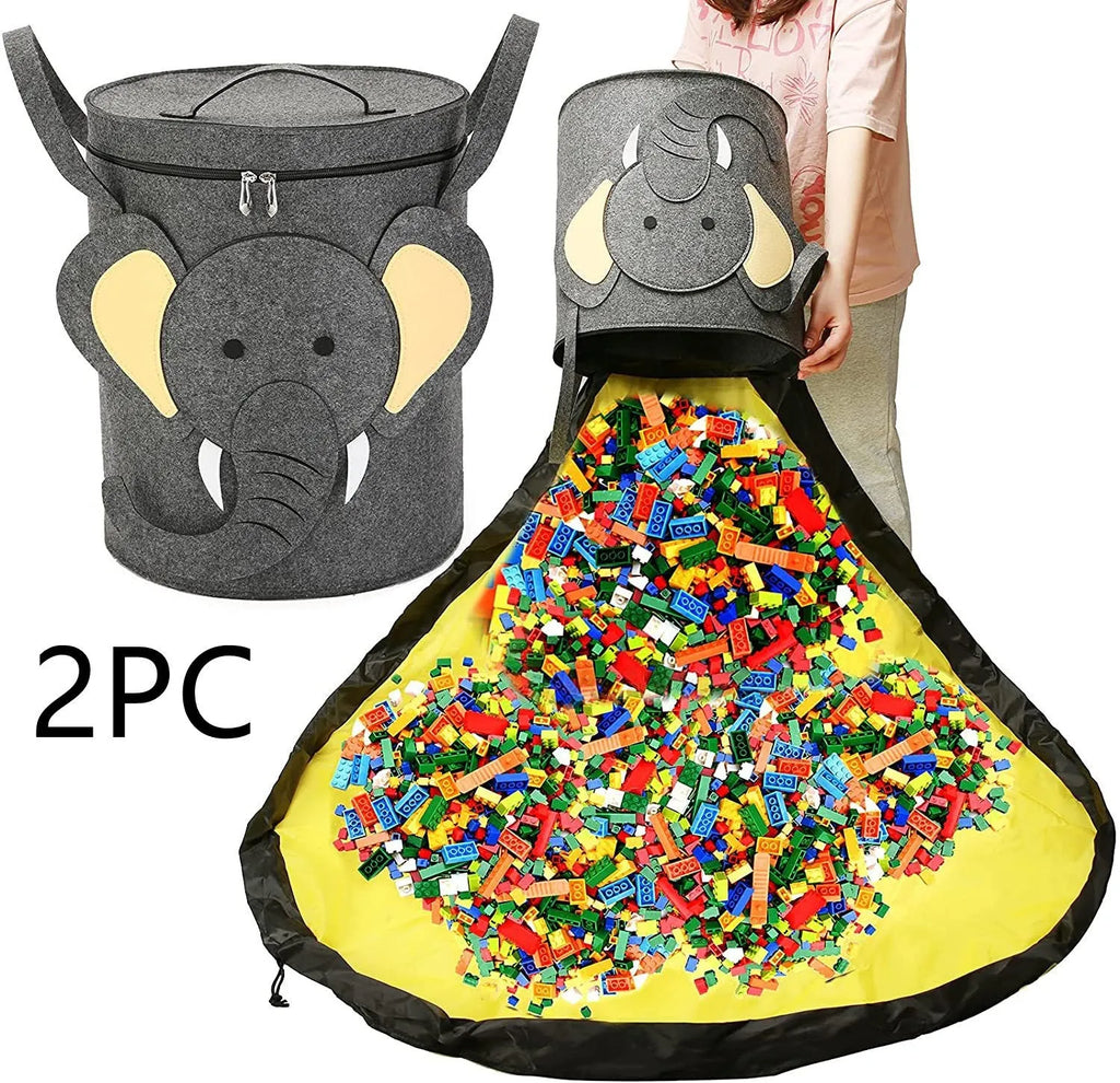 Green felt cube storage bag with pull rope open as a floor play mat for toys.