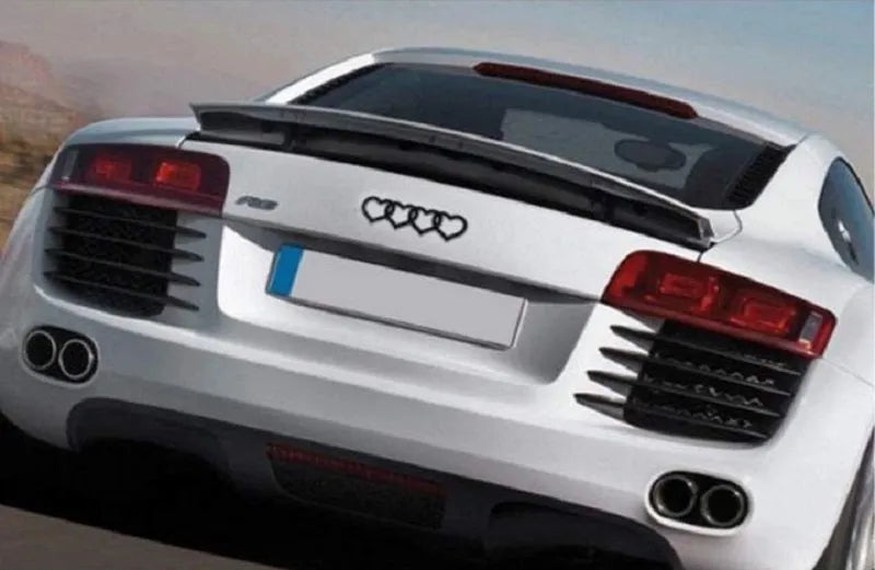 Heart-shaped body sticker with four-ring tail design in electroplated silver colour on a car bumper