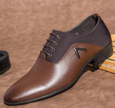 Men's black Oxford shoe with a low upper and rubber sole on a white background.