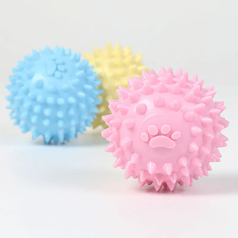 Blue TPR dog chew ball with footprint texture, 6cm diameter, for tooth cleaning and play.