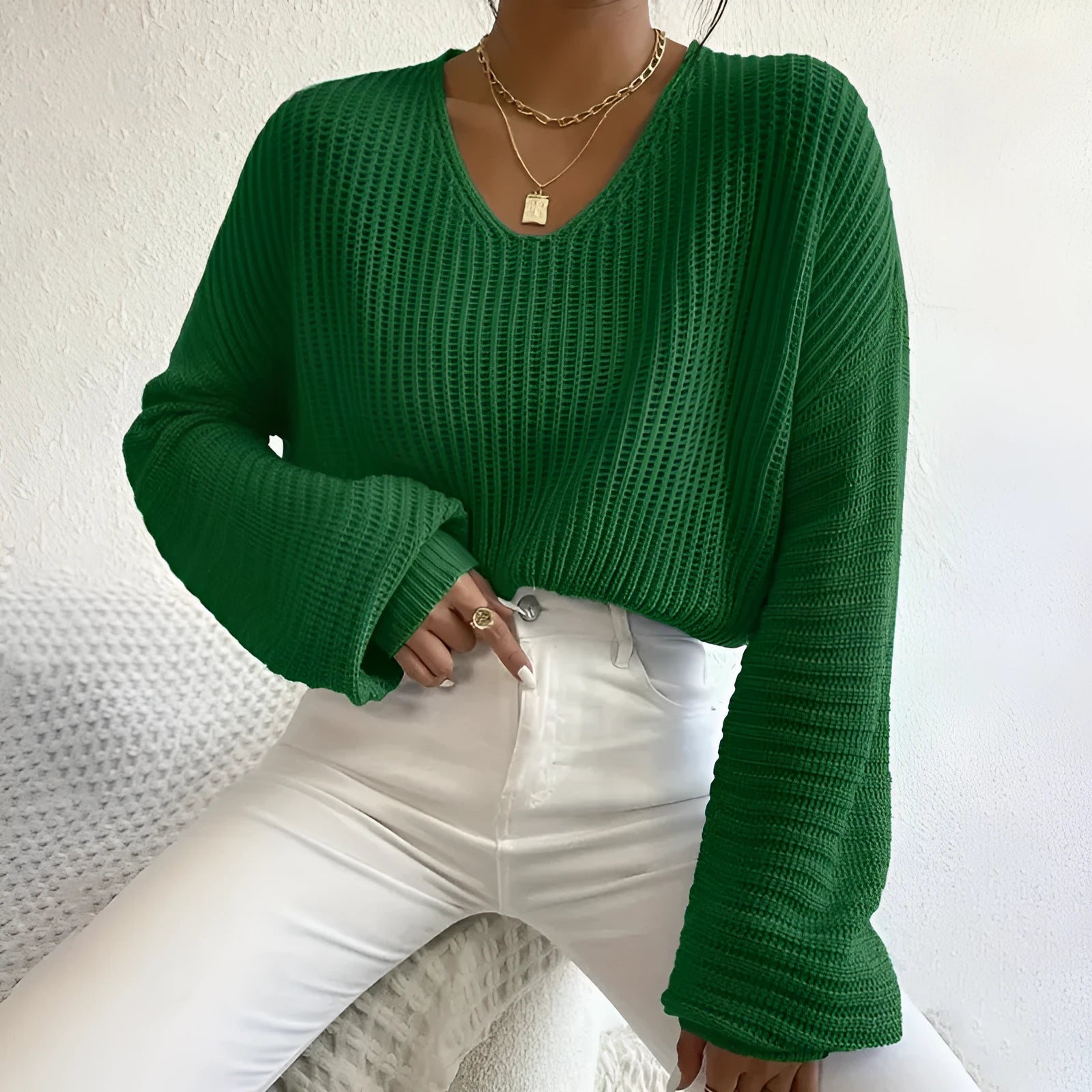 Women's solid colour long sleeve polyester pullover jumper in regular fit, shown in available colours.