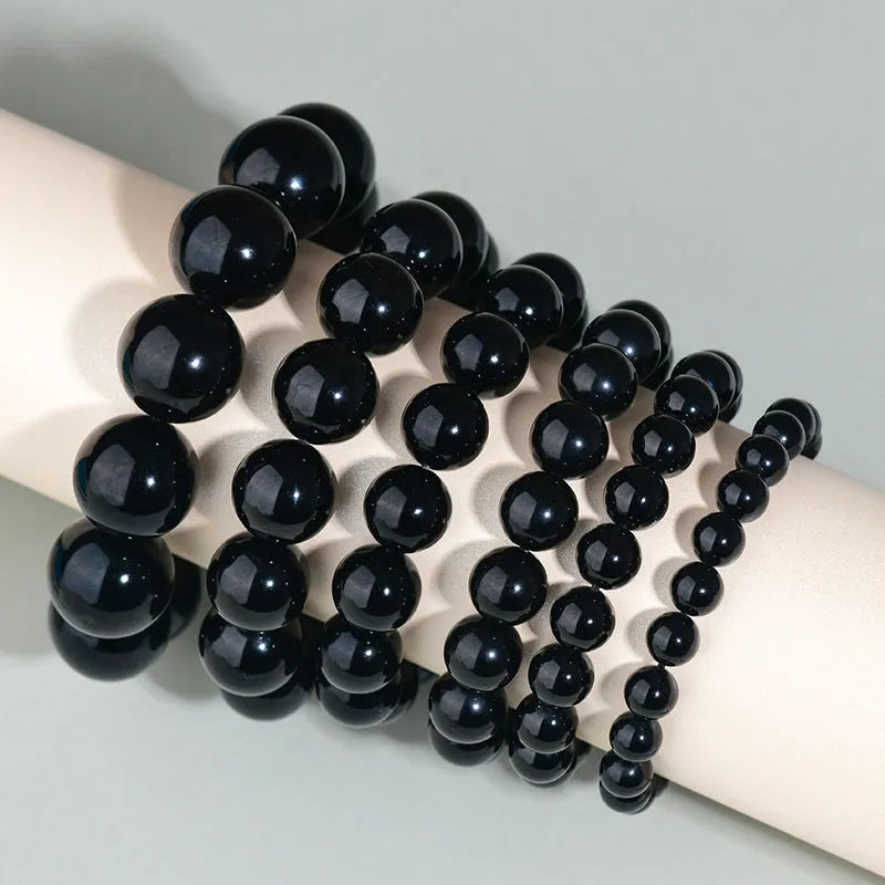 Hand-woven round obsidian crystal couple bracelet set showing ethnic-style design with multiple bead size options