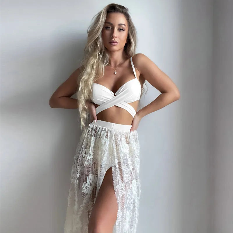 Sexy white three-piece bikini set with backless push-up top and skirt on a mannequin.